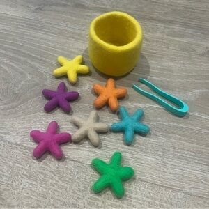 Lovevery Transfer Tweezers and Felt Stars toy from the Companion Montessori kit